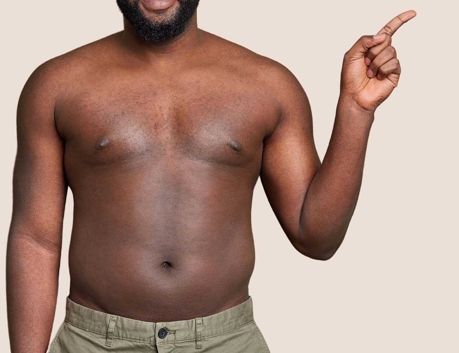 Model wearing beige lingerie set with hands on hips.